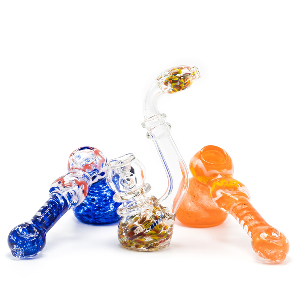 Three glass bubblers sitting on a table against a white background