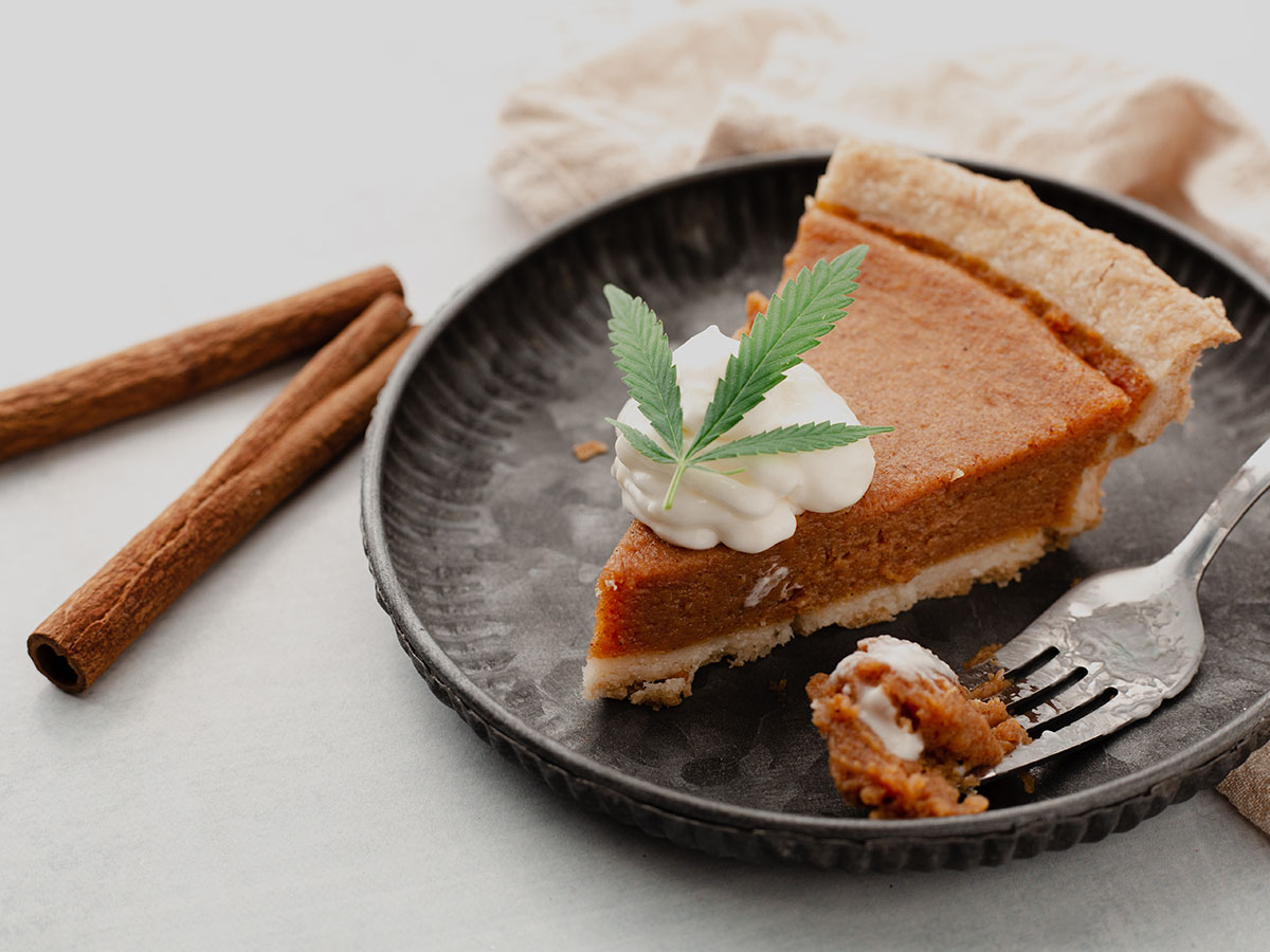 Pumpkin pie on a plate with a cannabis leaf on top