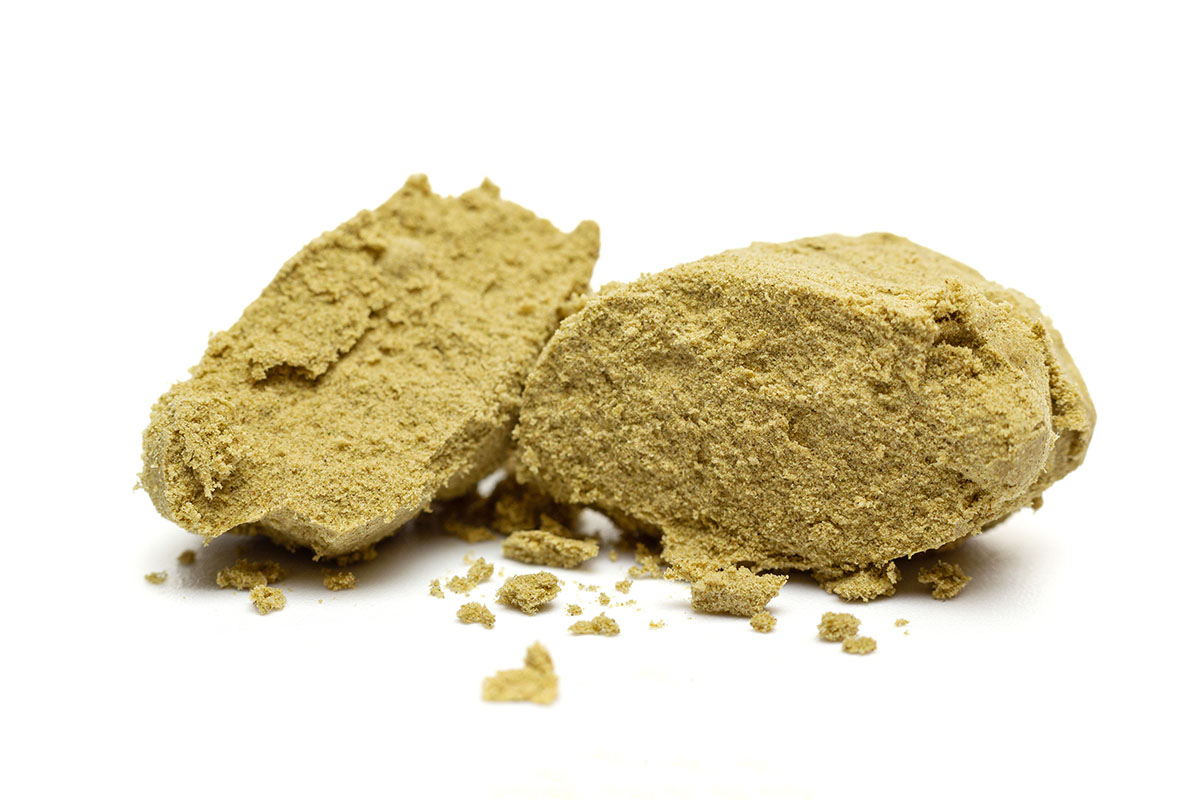 Brick of dry sift hash cut in half