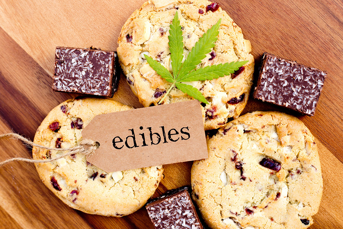 cookies and brownies stacked under a tag that says 'edibles'