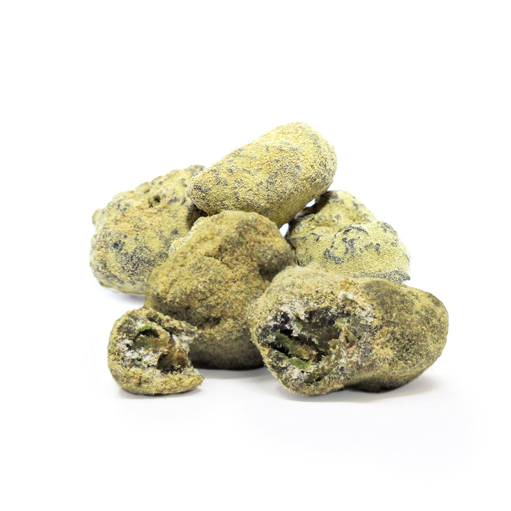 A pile of caviar buds dusted in kief sit against a white background, with the front one broken open.