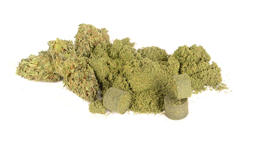 Pile of marijuana flower, loose kief, and hash pellets