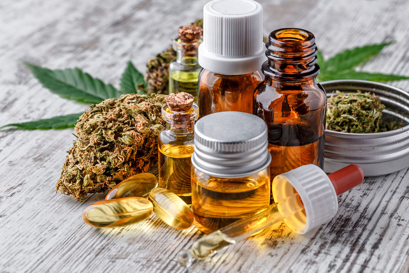 Group of cannabis products, including flowers, tincture bottles