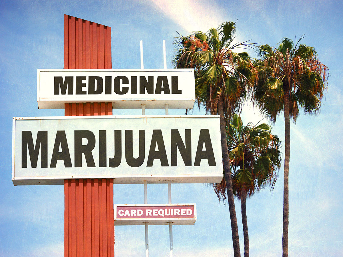 Medical Marijuana on a neon sign in front of palm trees