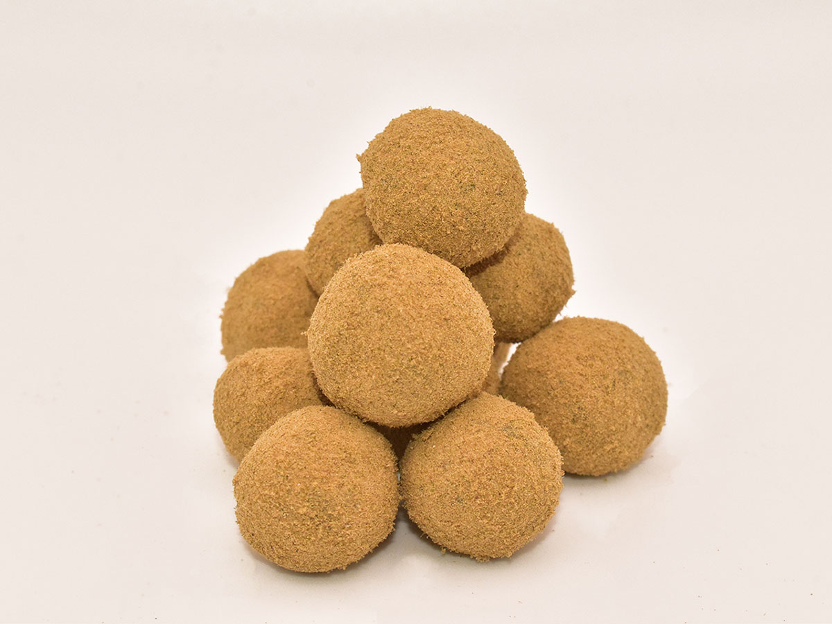 Pile of marijuana moon rocks on a pink background