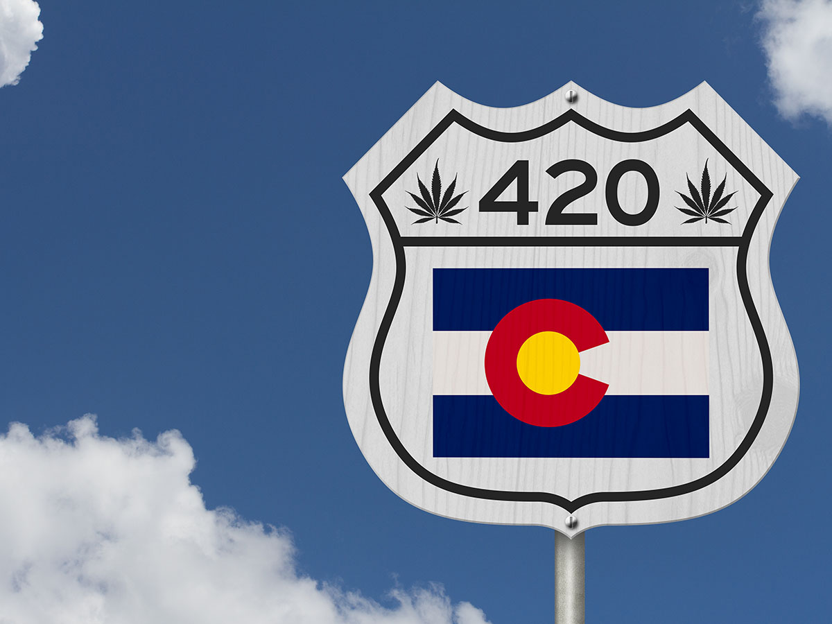 Colorado road sign that says 420 and has the CO flag