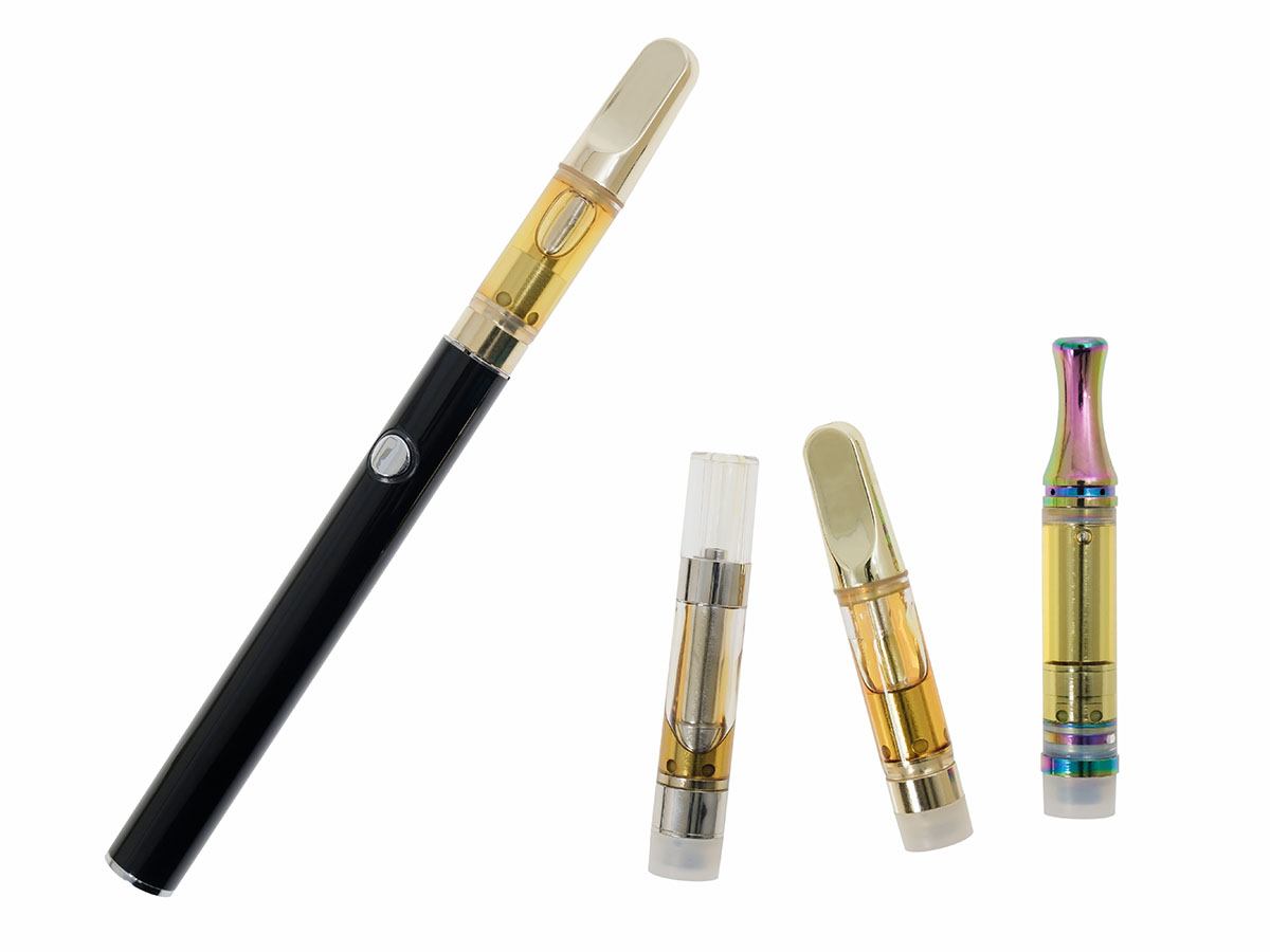 Full cannabis vape battery and cart next two three vape cartridges